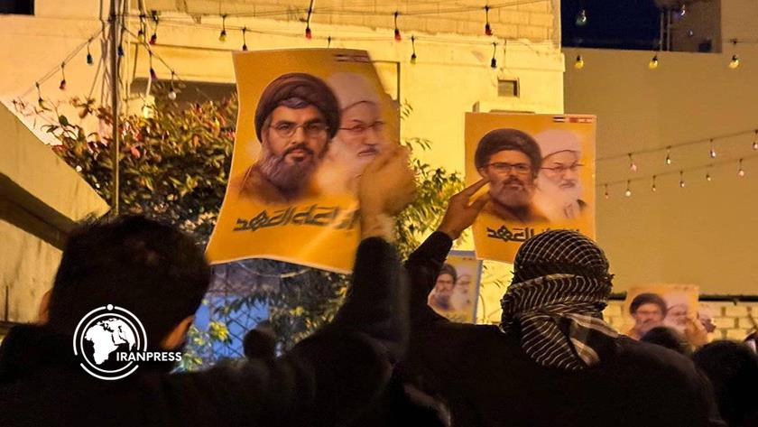 Iranpress: تظاهرة في البحرين تؤبن شهيدي الأمة السيد نصر الله والشيخ صفي الدين