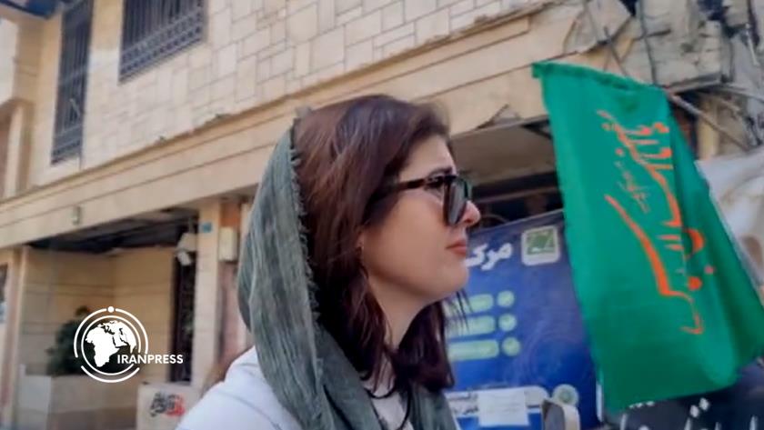 Iranpress: بكاء صحفية أمريكية عند رؤيتها أنقاض منزل شهيد نووي إيراني بطهران