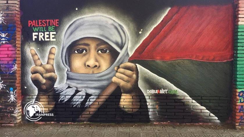 Iranpress: رسم جداري في برشلونة: فلسطين سوف تحرر 