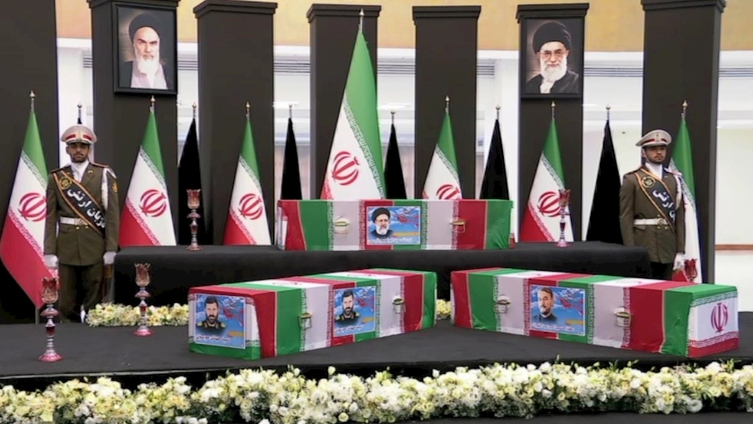 Iranpress: انتقال پیکرهای مطهر شهدای خدمت به سالن اجلاس سران 