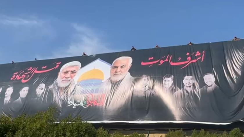 Iranpress: ببینید: نصب بنر بزرگ شهدا در محل شهادت شهید سلیمانی در جاده فرودگاه بین المللی بغداد