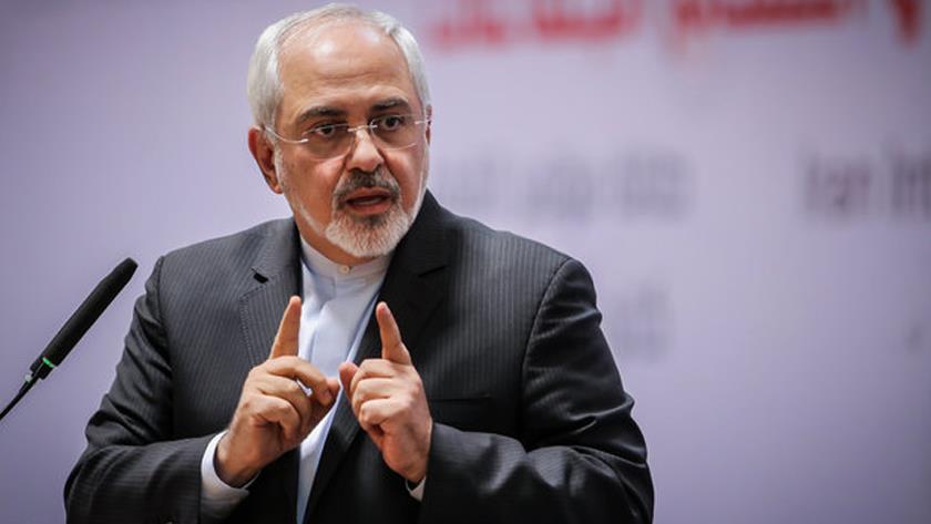 Iranpress: Zarif to Le Drian: Stop abiding by US illegal sanctions against Iran