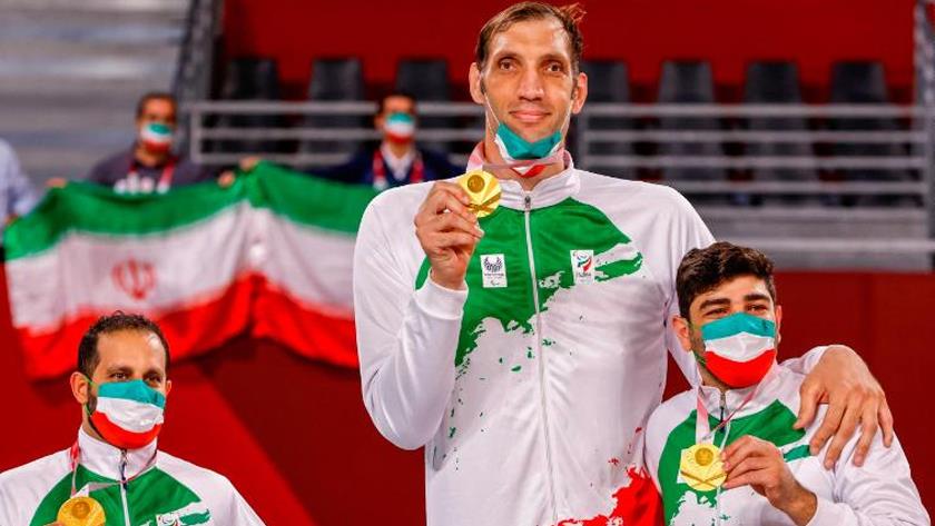 Iranpress: Morteza Mehrzad, Tiger Woods and Roger Federer in sitting volleyball