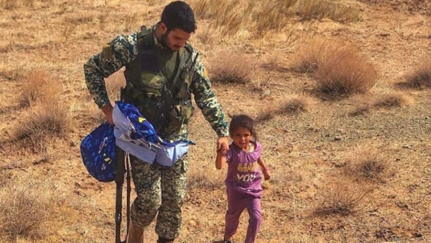 Iranpress: Afghan refugee child sheltered by Iranian army