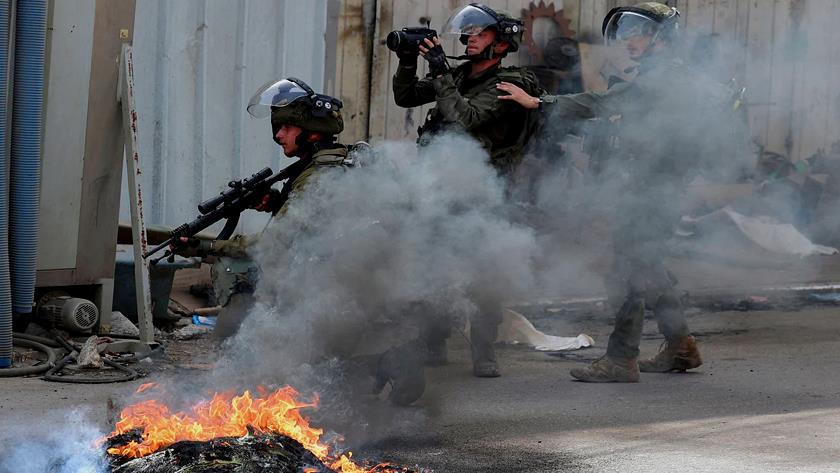 Iranpress: Zionists raid Jenin; 2 Palestinians injured