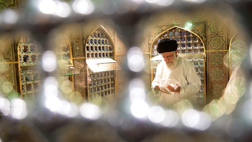 Iranpress: Leader attends Dust Clearing Ceremony at Imam Reza holy shrine
