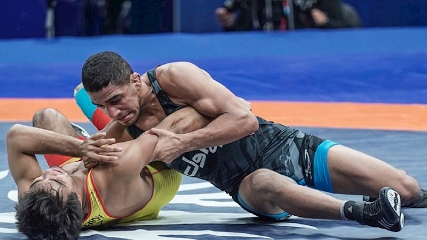 Iranpress: 2 Iranian freestyle wrestling athletes reach final