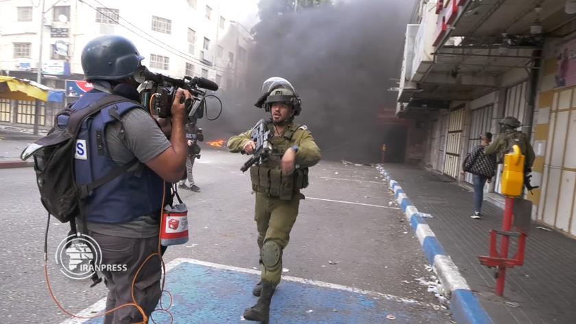 Iranpress: Clashes underway in Al-Khalil after Israeli forces attack