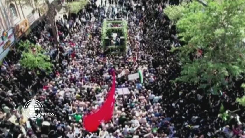 Iranpress: People of Iranian northeastern city of Sabzevar attend funeral of Martyr