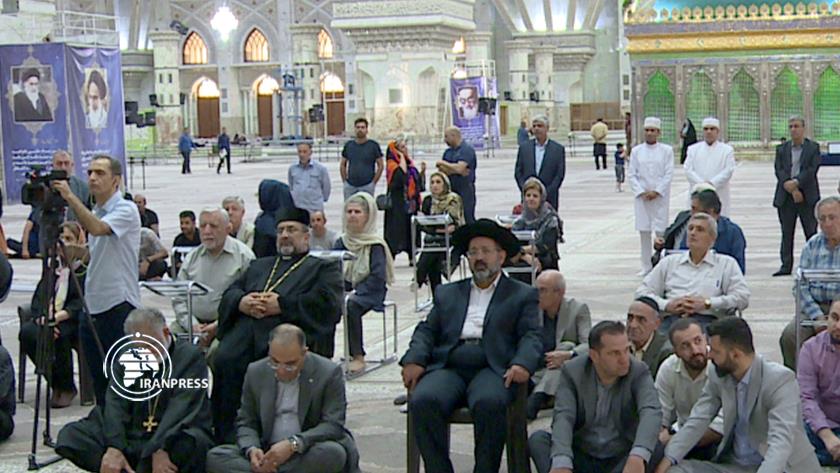 Iranpress: Followers of divine religions pay respects to Imam Khomeini