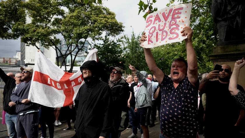 Iranpress: UK Police Arrest Dozens Amid Violent Protests Following Stabbing Attack