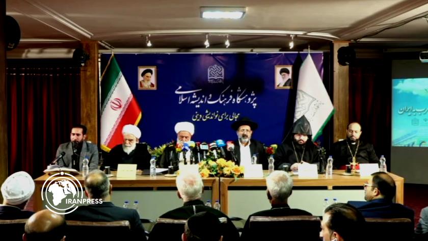 Iranpress: Followers of Divine Religions International Symposium Kicks off in Tehran