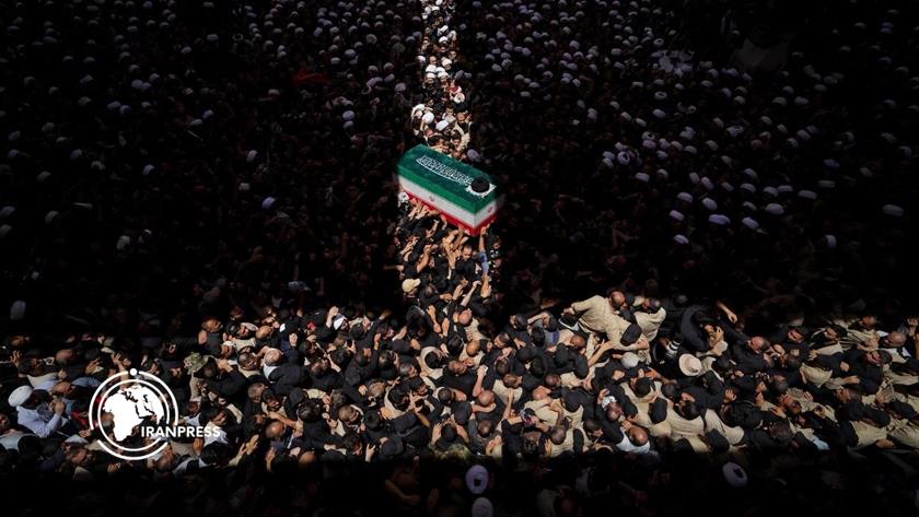 Iranpress: Martyred Leader’s Coffin Circumambulated Around Imam Ali’s Shrine