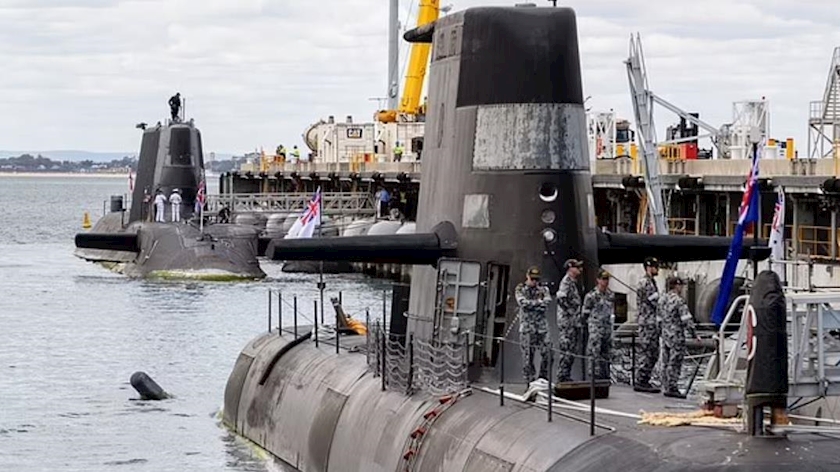 An Australian Collins class submarine (front) and the UK nuclear-powered attack submarine, HMS Astute (rear) at HMAS Stirling Royal Australian Navy base in Perth on October 29, 2021. 